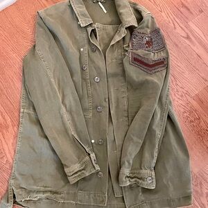 Olive green fall jacket. Cool patch.